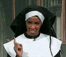 Angry nun wagging her finger