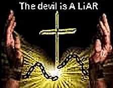 Hands uplifted with broken shackles in front of a cross