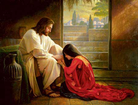 Woman kneeling at Jesus' feet
